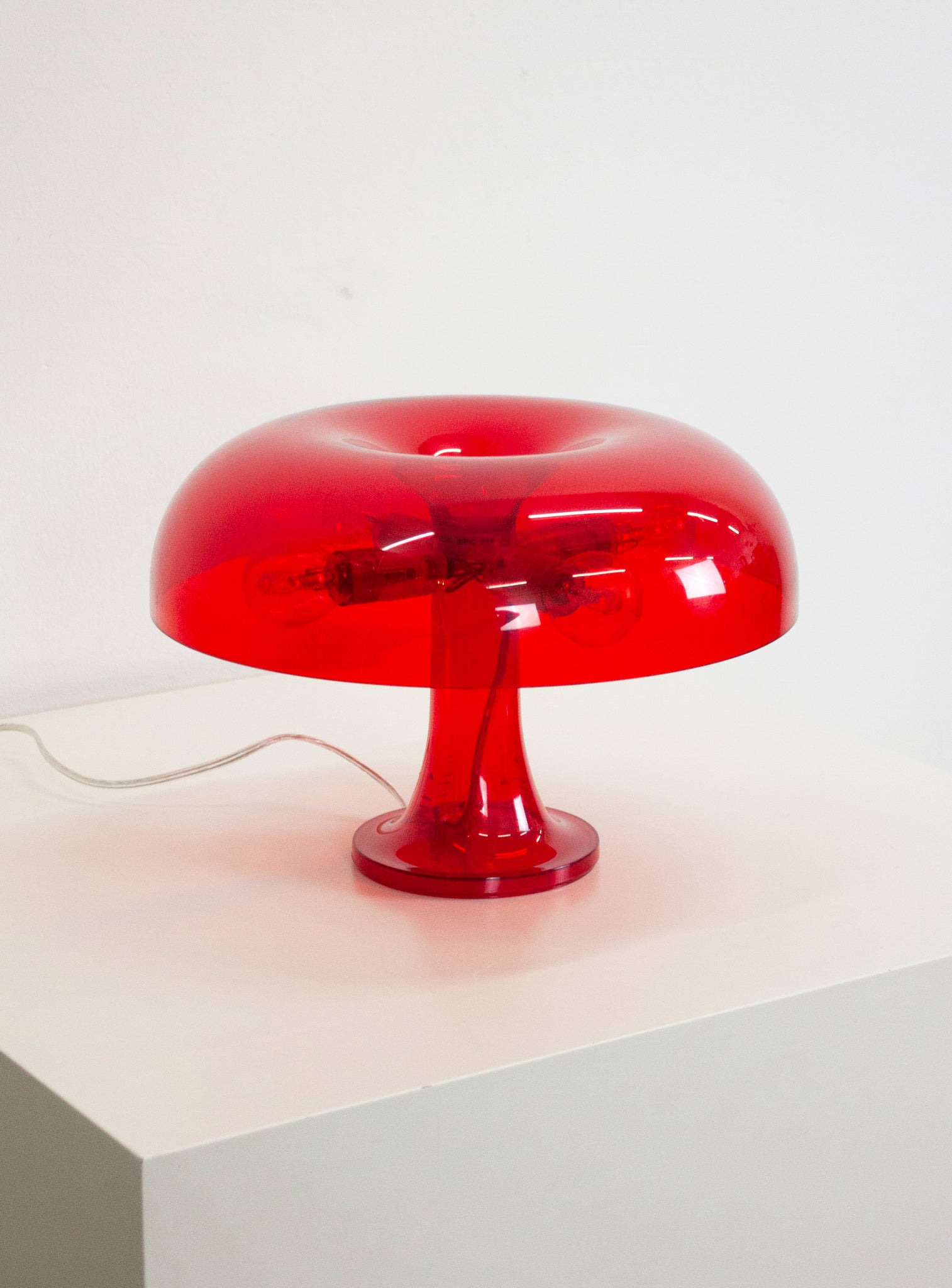 Artemide Nessino Desk Lamp by Giancarlo Mattioli (Translucent Red)