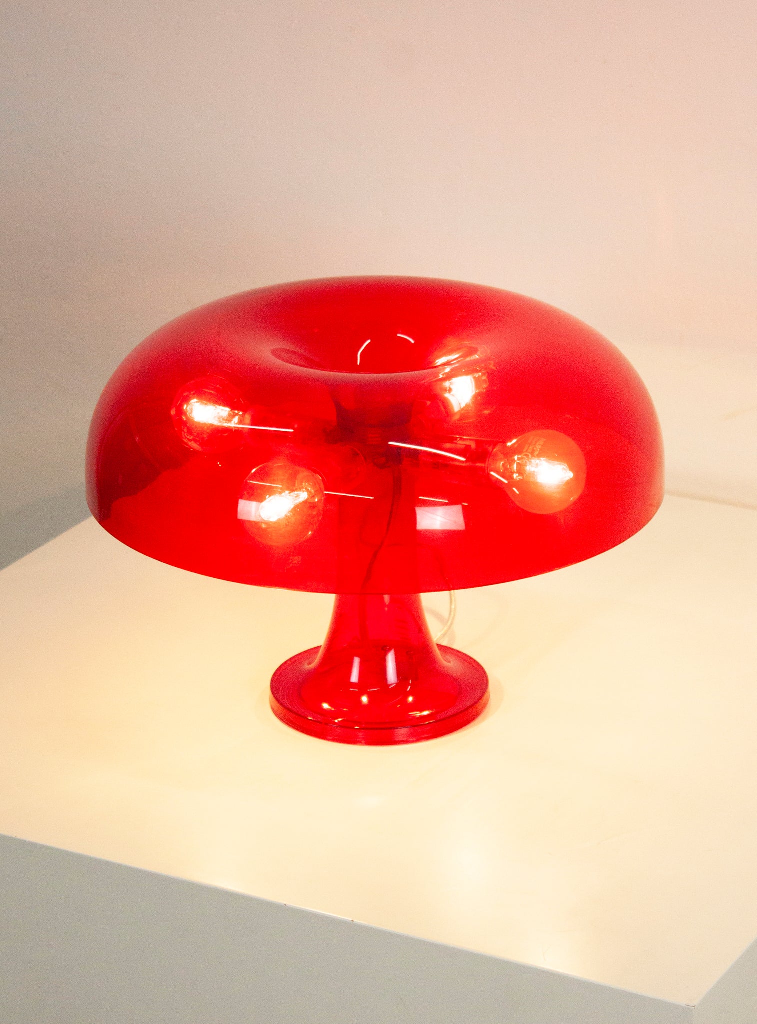 Artemide Nessino Desk Lamp by Giancarlo Mattioli (Translucent Red)