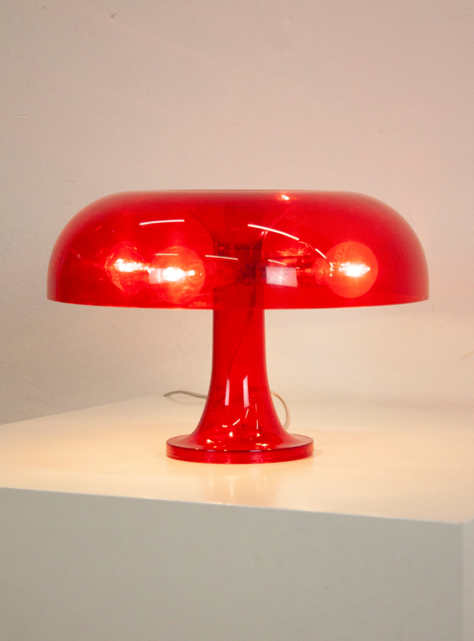 Artemide Nessino Desk Lamp by Giancarlo Mattioli (Translucent Red)