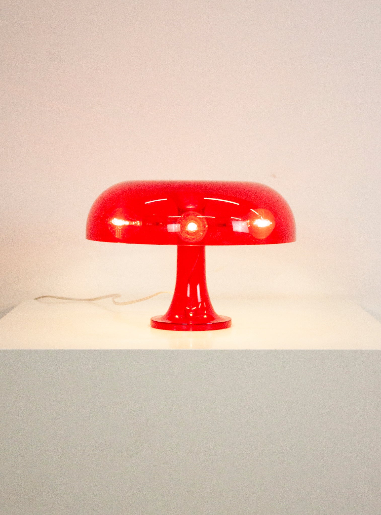 Artemide Nessino Desk Lamp by Giancarlo Mattioli (Translucent Red)