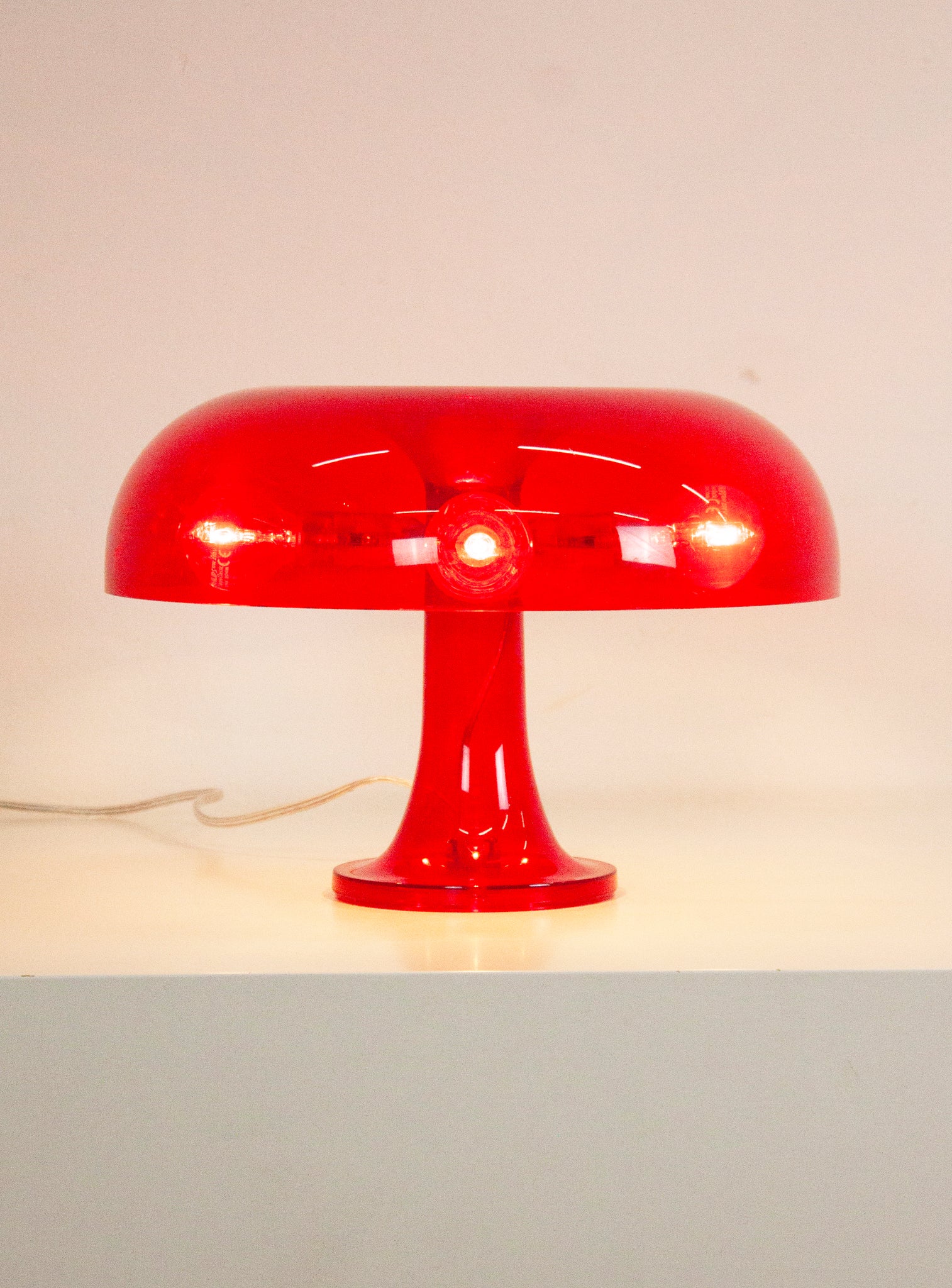 Artemide Nessino Desk Lamp by Giancarlo Mattioli (Translucent Red)