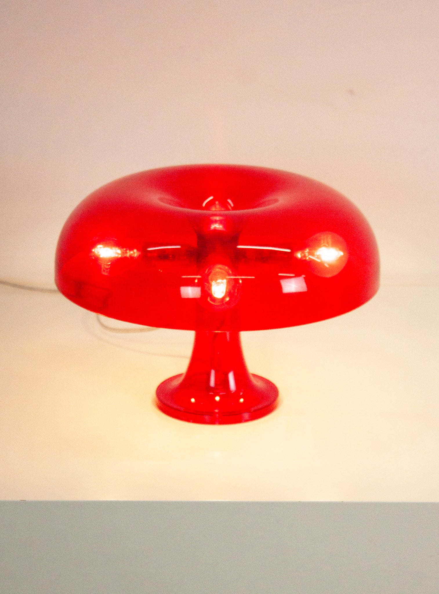 Artemide Nessino Desk Lamp by Giancarlo Mattioli (Translucent Red)