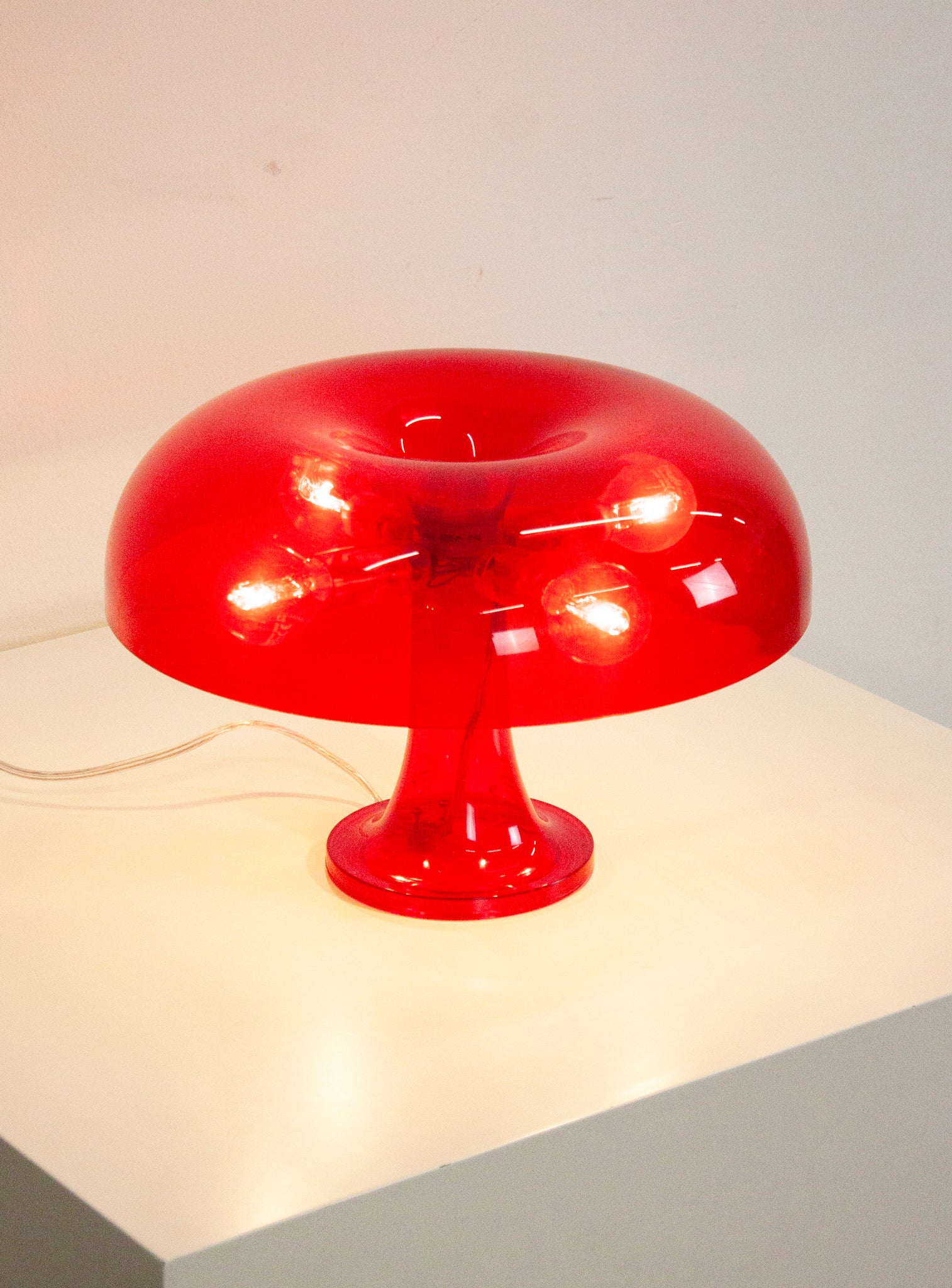 Artemide Nessino Desk Lamp by Giancarlo Mattioli (Translucent Red)