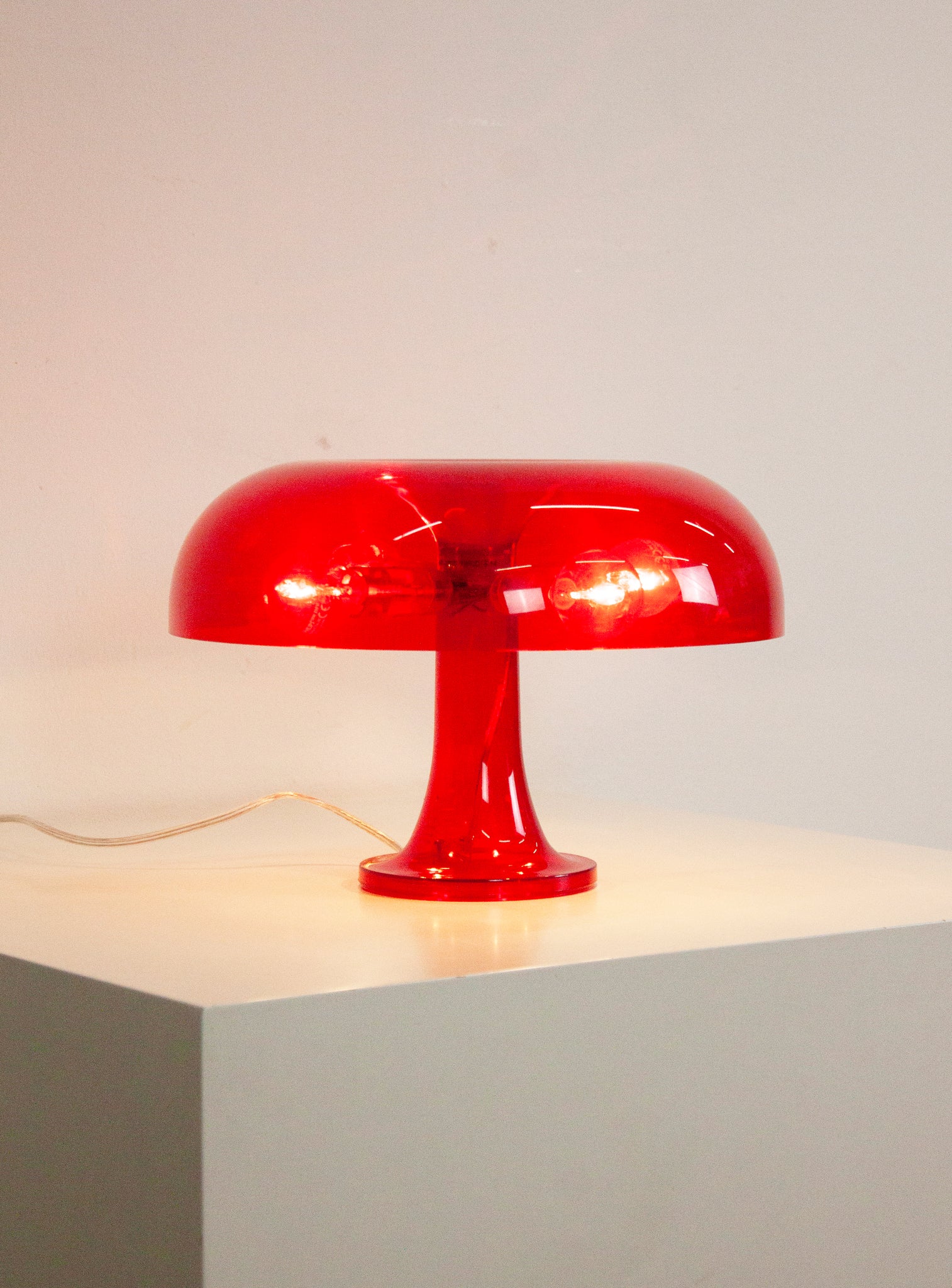 Artemide Nessino Desk Lamp by Giancarlo Mattioli (Translucent Red)