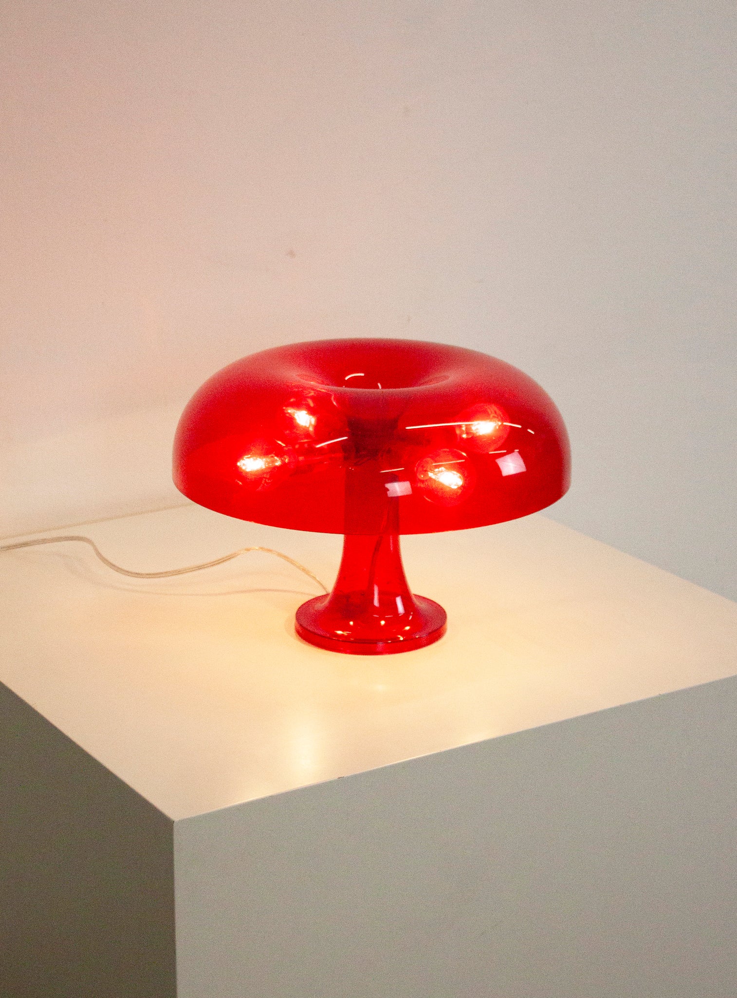 Artemide Nessino Desk Lamp by Giancarlo Mattioli (Translucent Red)