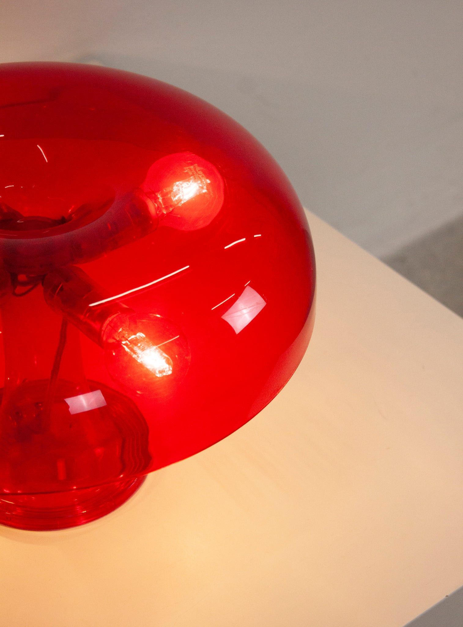 Artemide Nessino Desk Lamp by Giancarlo Mattioli (Translucent Red)