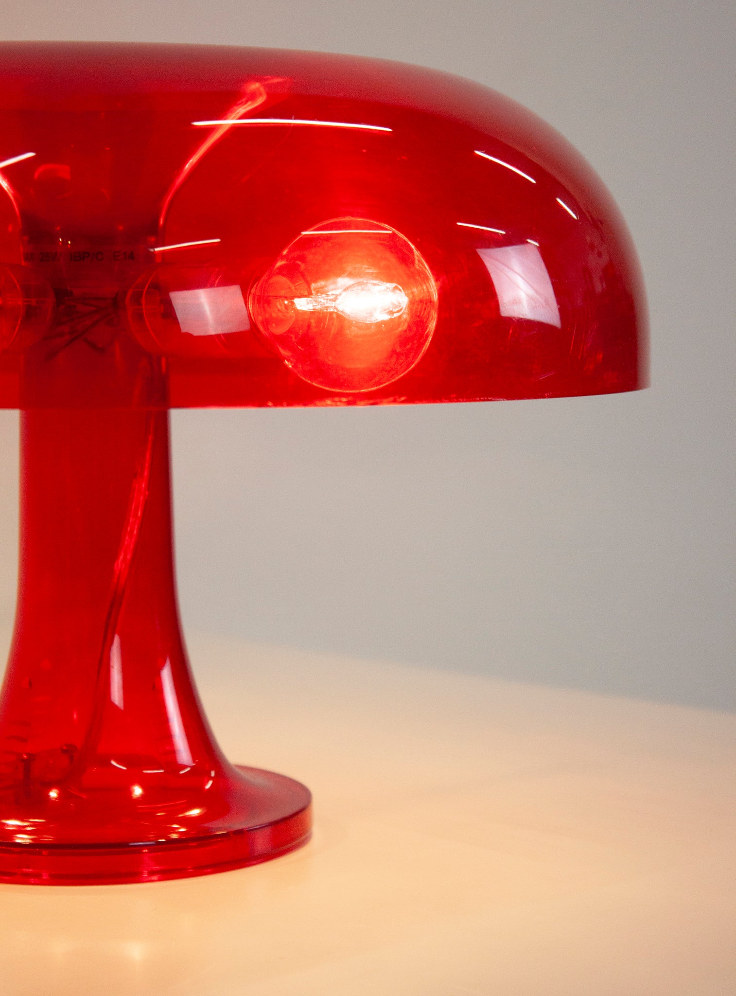 Artemide Nessino Desk Lamp by Giancarlo Mattioli (Translucent Red)