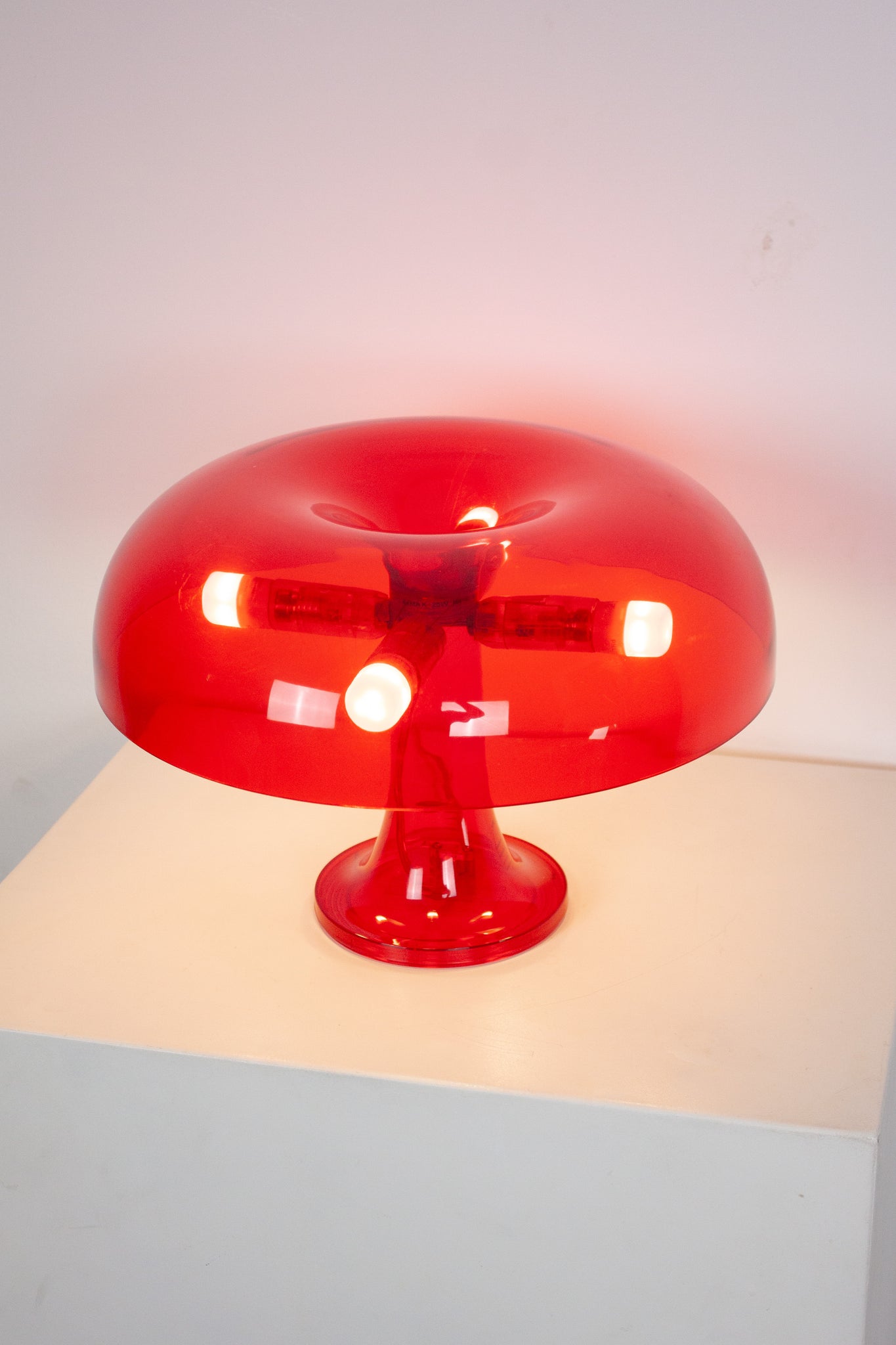 Artemide Nessino Table Lamp by Giancarlo Mattioli (Translucent Red)